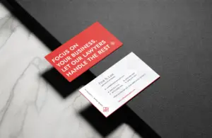 Business cards for a law firm on a table.