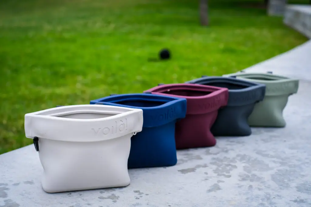 Colorful silicone containers lined up outdoors