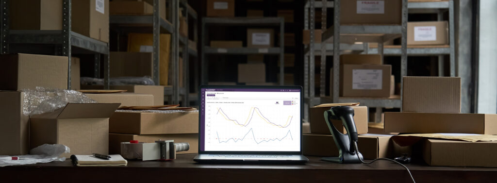 Laptop showing inventory data in warehouse