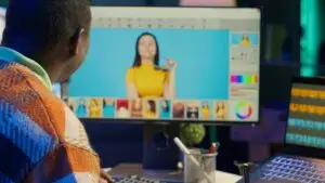 Person editing photo on computer screen.