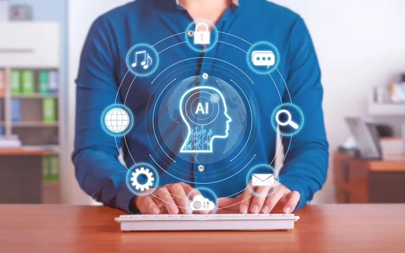 Person typing, AI concepts overlay