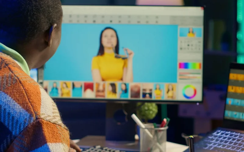 Person editing photo on computer screen.